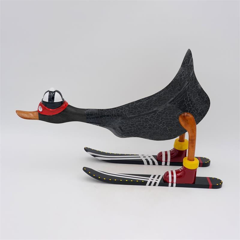 Canard "Finn" - grand, penché en avant, gris foncé avec des skis