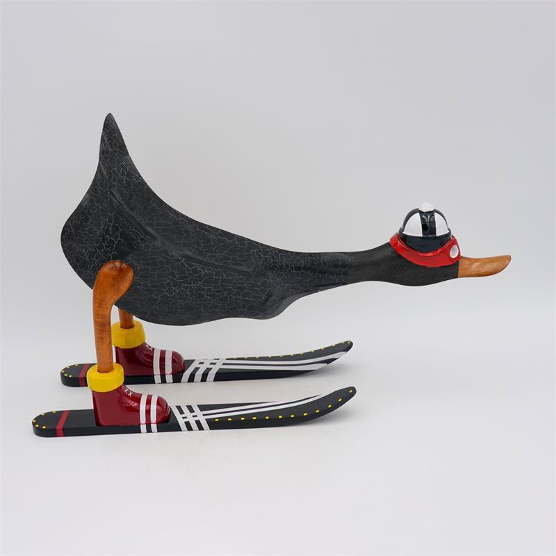 Canard "Finn" - grand, penché en avant, gris foncé avec des skis