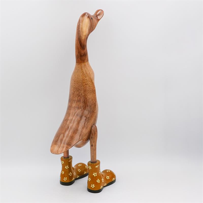 Canard « Bertha » énorme, brun, dressé, doré avec des fleurs