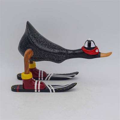 Canard "Fabian" - petit, penché en avant, gris foncé avec des skis